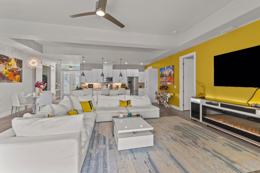 Open concept at Villa Dandelion with living room, kitchen, and dining area in light colors and modern style.